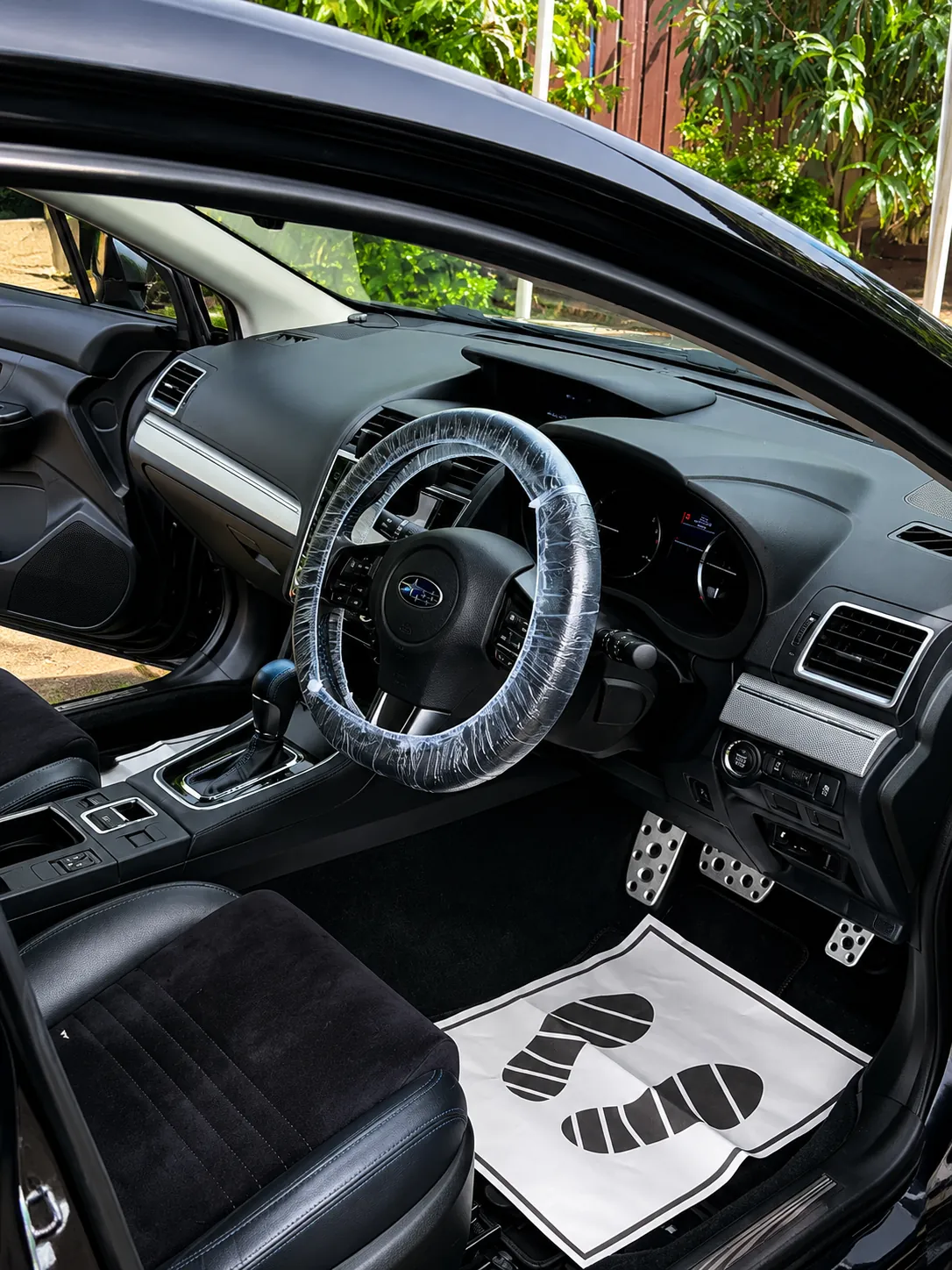 Detailed Subaru interior with protected steering wheel
